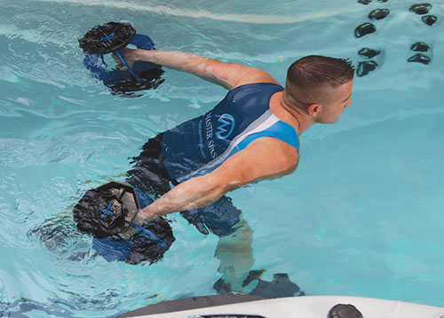 Man using weights in swimspa